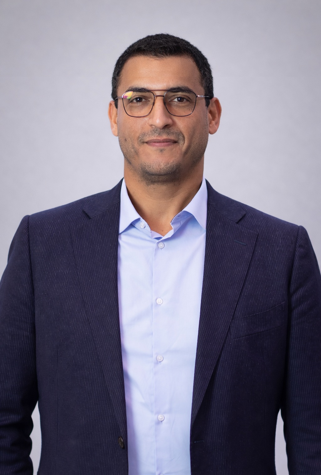Mouncef Mahlaoui, Founder and Managing Director of Phi-NEXT, wearing a dark navy blazer